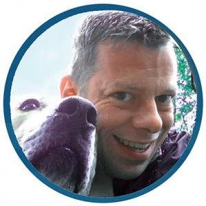 Author Mark Saluke and his dog Lucy