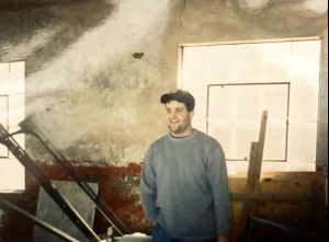 A throwback photo showing Marc Brennan, one of Universal Joint's co-founders standing in the original Decatur Gas Station