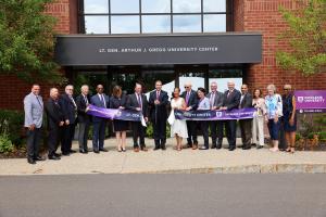 Excelsior University and Capital Region Chamber leaders join Lt. Gen. Arthur J. Gregg's daughter, Alicia Collier, to cut the ribbon to officially dedicate the Lt. Gen. Arthur J. Gregg University Center