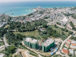 Sol Harbour Residential Complex in Ocho Rios, Jamaica, featuring direct beach access and ocean-view balconies.