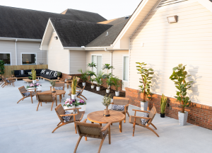 spacious outdoor patio  comfortable chairs and plants