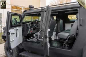 Alpine Armoring Pit-Bull VXT® Tactical Truck doors open showing interior