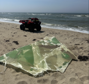 A fiberglass section of a wind turbined blade from the Vineyard Wind 1 project washes ashore in Nantucket in July 2024. Photo courtesy of Nantucket.