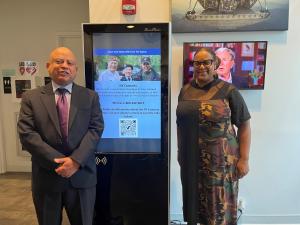 DVS Executive Deputy Commissioner Joel Evans & DVS Commissioner Viviana M. DeCohen are pictured next to a DVS Digital Kiosk during today's unveiling at the LT Michael P. Murphy Navy SEAL Museum in West Sayville, NY.