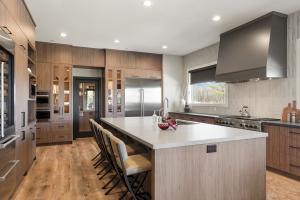 Award-winning kitchen featuring contemporary style cabinets in textured walnut.