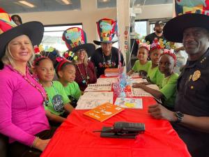 Embrace Girls and community leaders celebrate national reading day and Dr Seuss's birthday.