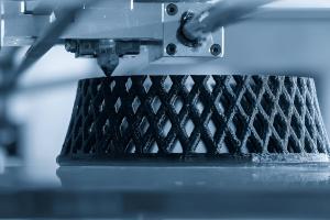 Industrial 3D printer creating a lattice-structured part, illustrating advanced additive manufacturing in action.
