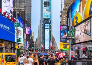 Crowds gather in Times Square beneath a giant digital billboard featuring Milkis, Korea’s No. 1 creamy fizz, during a Korean food event on July 14, 2025.