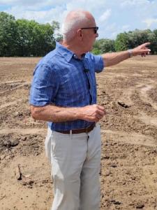 Photo of Colonel John Folsom standing where Dunham House will be built.