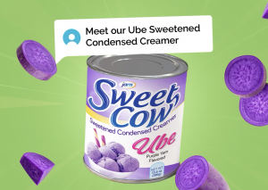 A can of Sweet Cow Ube Sweetened Condensed Creamer set against a green background with floating purple yam slices, showcasing the product’s rich flavor and vibrant color.