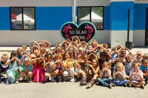 Nampa Boys & Girls Club attendees gather around the latest CBH Homes Hearts Across the Valley Club.