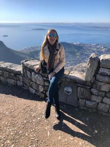 Kerrie Young walking through Cape Town, South Africa, during a Prosperity Of Life leadership retreat, representing her freedom-filled lifestyle and global business journey.