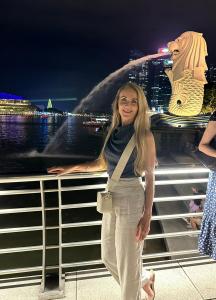 Kerrie Young in Singapore, enjoying the city while running her online business, highlighting the freedom and mobility of her digital lifestyle.