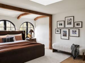 large gallery wall in bedroom installed with gallery wall template