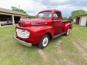 1949 cherry red Ford F1 pickup. Roger’s favorite! Powered by an FH V8 engine with manual transmission. Odometer shows 70,057. The interior is black bench and has a heater, AM radio.