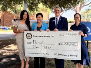 Four people stand outdoors holding a large ceremonial check for $1 million made out to Maryvale, presented by Congresswoman Judy Chu and Maryvale President & CEO Steve Gunther, alongside two Maryvale board members. The check supports the Seton House expan
