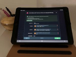 The VOCUS SMS AI Assistant shown on ipad tablet