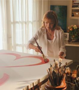 Photo of Jane Seymour in Art Studio Painting the Iconic Open Heart