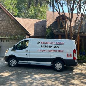 A white service van parked in front of a home, displaying logo of "911 Service Today"