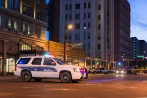 Phoenix Police SUV with emergency lights on, conducting a DUI operation in downtown at night.