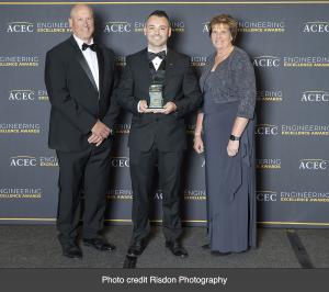 Thomas P. Schaefer, P.E., D&B Senior Associate (center) accepts the Recognition Engineering Excellence Award (EEA) on behalf of D&B Engineers and Architects. Credit: Risdon Photography