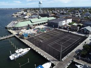 The Incorporated Village of Ocean Beach is uniquely located on a barrier island situated off the south shore of Long Island.  Access is by either ferry or barge. Due to limited space, the Village’s basketball and tennis courts served as the ideal waterfro