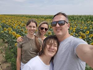 Ana Mitrovic traveling with her husband and children, exploring new places as a family — made possible by her flexible, tech-powered work-from-home business.