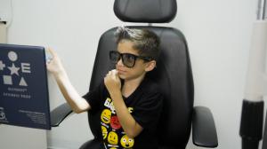 A child taking a stereo vision test with a Houston eye doctor at TSO Champion for back-to-school eye exams.