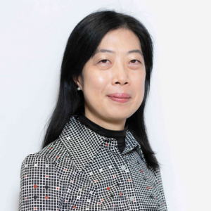 Portrait of Onis Wong, Fathom Certified Partner for Greater China, wearing a patterned blouse and smiling confidently against a white background.