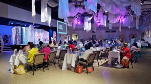 Katie Hornor on NACWE stage with audience