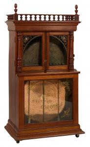 An early 20th century Regina Corona music box with a 27-inch disc automatic changer, in a Honduran mahogany case, 73 inches tall by 39 inches wide, should garner $5,000-$10,000.