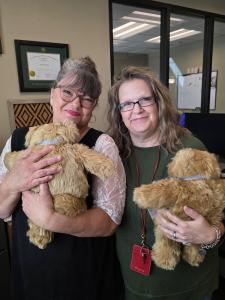 Central Texas flood survivor supporters hugging their Comfort Cubs.