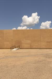 an image by Natalie Christensen of a bridge leading directly into a wall