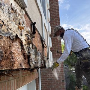 ZD Stucco Repair staff working on repairing the rotted plywood in the stucco system