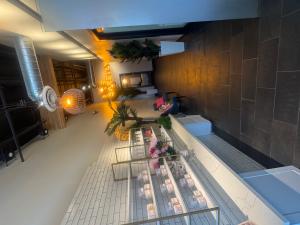   Alt Text: Interior of Sugar Sugar’s flagship Scottsdale spa featuring modern design and organic sugaring treatment stations.