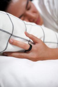 Actxa Core Smart Ring being worn to sleep for sleeptracking