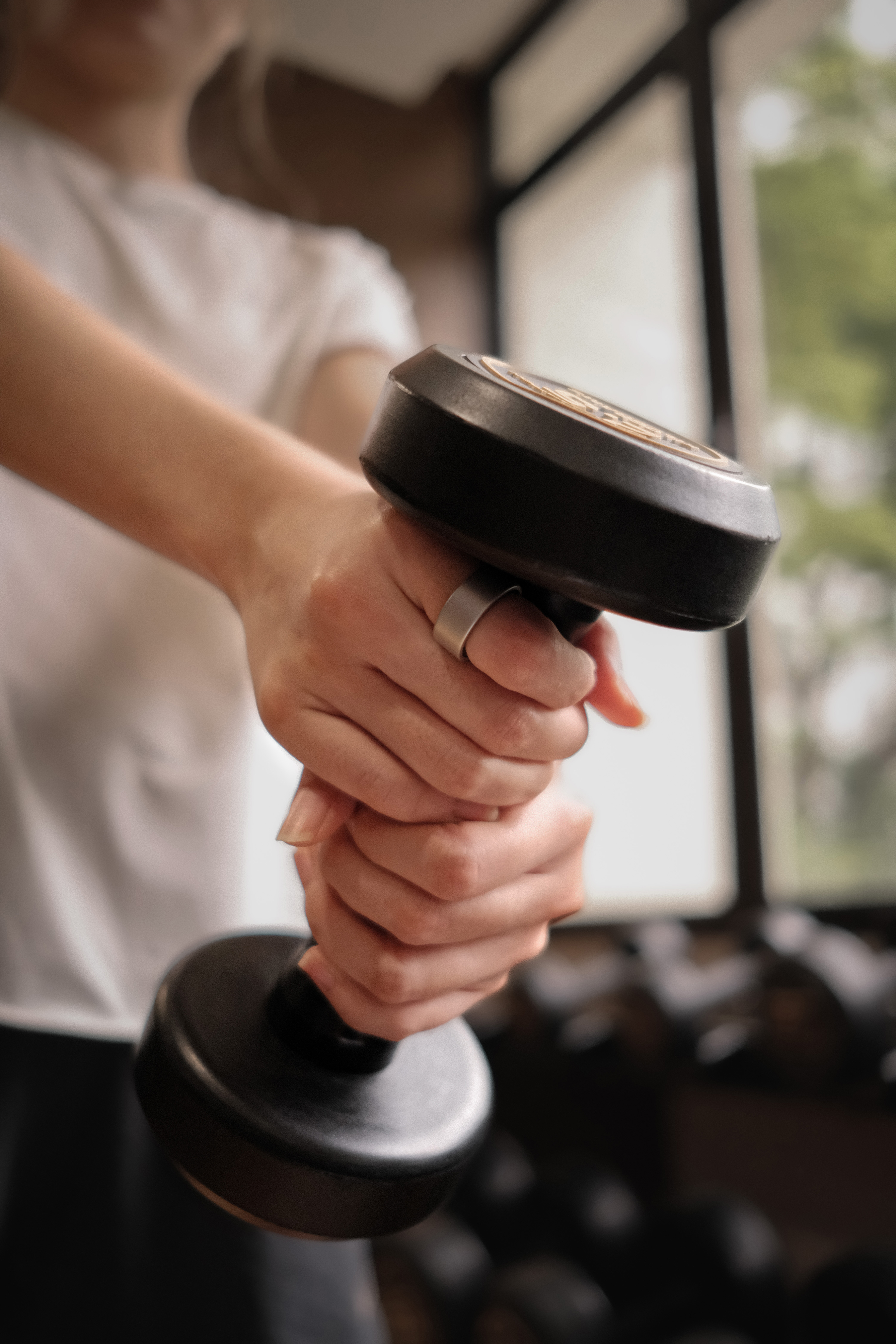 Actxa Core Smart Ring worn during a weights workout