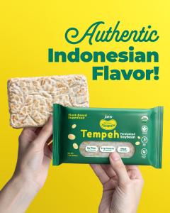 Hands holding Royal Tempeh USDA Organic fermented soybean tempeh and packaging with “Authentic Indonesian Flavor” text on a bright yellow background, emphasizing its plant-based and high-protein benefits.