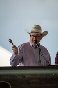 Auctioneer selling a junior livestock auction in Colorado