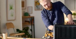 Handyman Repairing appliance at home.