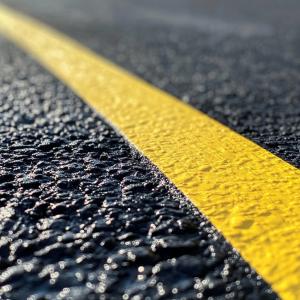Professional parking lot line striping in Auburn, AL with crisp, ADA‑compliant markings for improved safety and appearance.