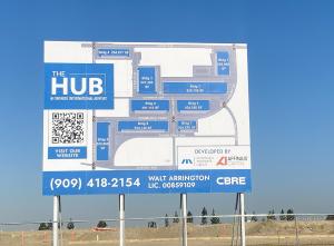 A billboard depicting the lot layout for the 9 buildings of project "The Hub" at Ontario