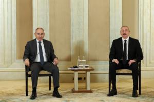 Prime Minister Nikol Pashinyan of Armenia (left) and President Ilham Aliyev of Azerbaijan (right) sit for an official photo during a meeting in Abu Dhabi in July. photo from primeminister.am