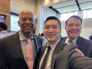Patrick Cheng, CEO of General Tso’s Restaurant & Catering, stands with two community leaders during a business chamber and civic engagement event in Atlanta, Georgia.