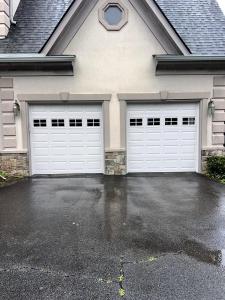 White double garage door with raised panels installed by Neighborhood Garage Door of Rockville