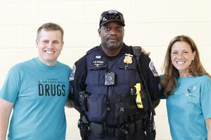 Drug Free World volunteers with Police Officer