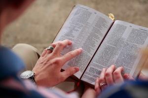 An evangelical couple shares a Bible during a church service.