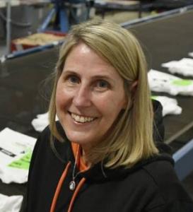 Lana Corsano, Founder and CEO of Bolt Printing, smiling in a professional headshot portrait.