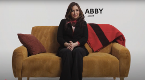 Livingston County Hope & Help Story image of Abby sitting on a couch