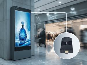 Azulle Access ARM mini PC stick shown alongside a large digital signage display in a shopping mall, illustrating its use in retail environments.